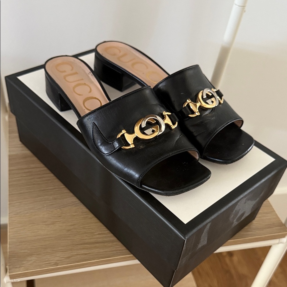 Gucci Black Mules with Gold Detailing